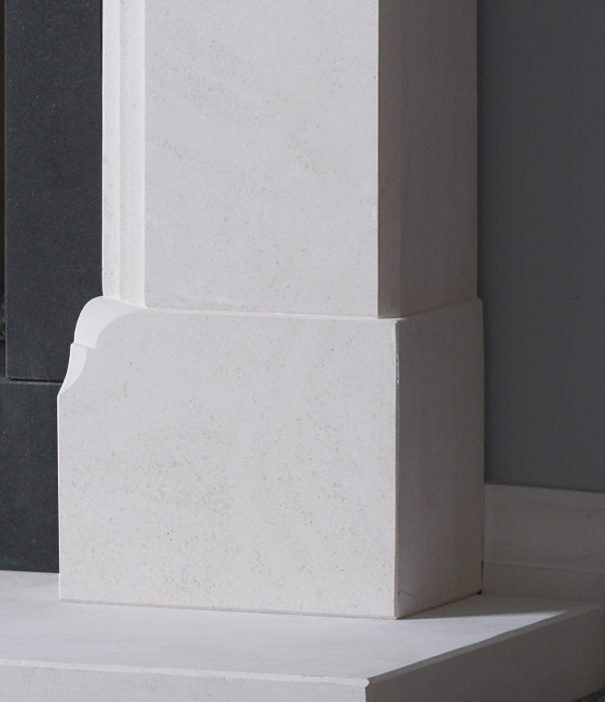 Beaufort Iberian limestone fireplace surround — leg base and matching hearth detail