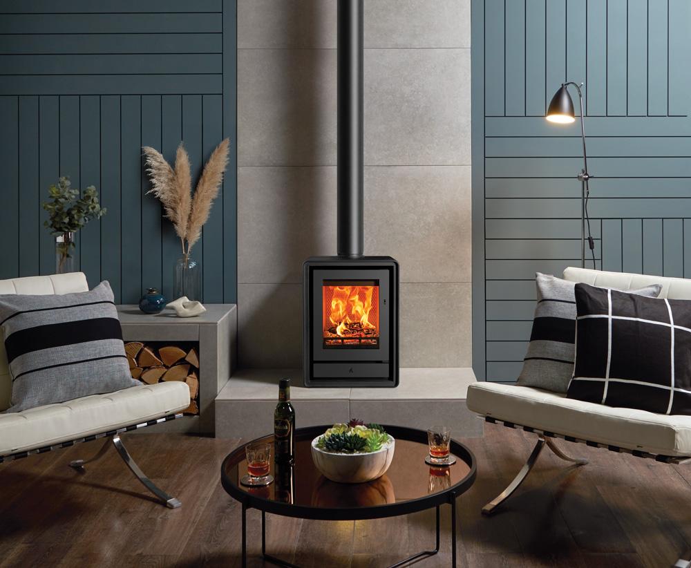 Stovax Riva2 40 freestanding fire between two pale sofas in a blue room