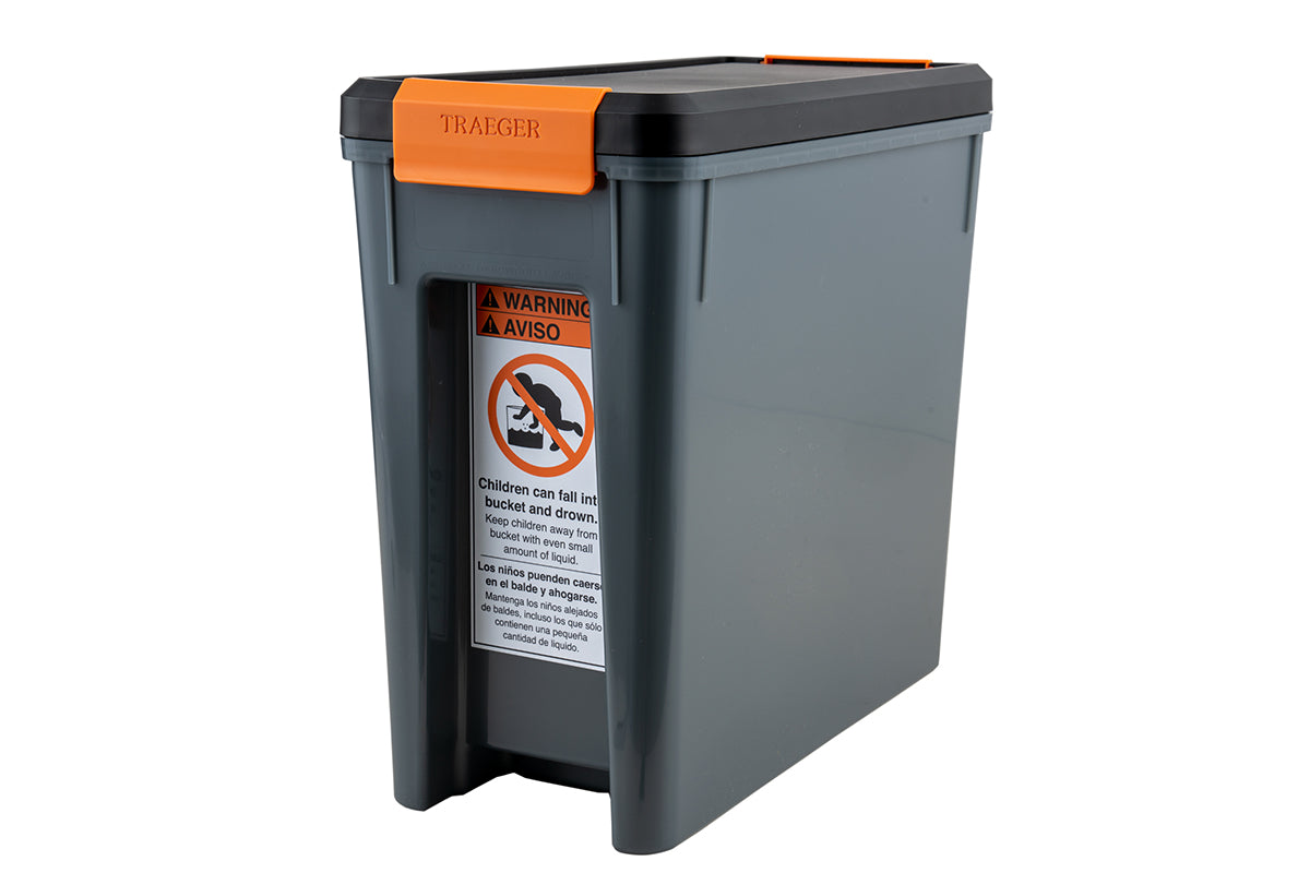 Traeger StayDRY pellet bin showing the child safety warning label on its side