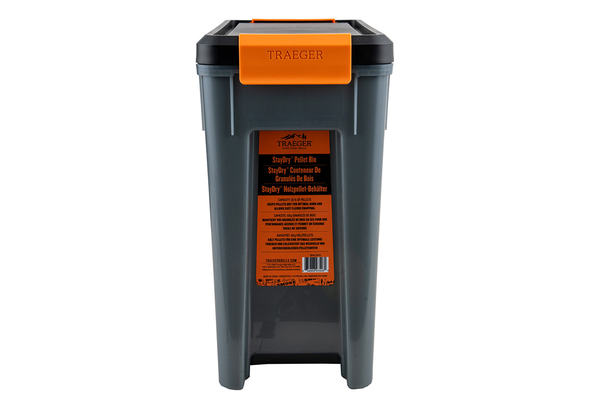 End view of the Traeger StayDRY pellet bin with its orange latch and product label