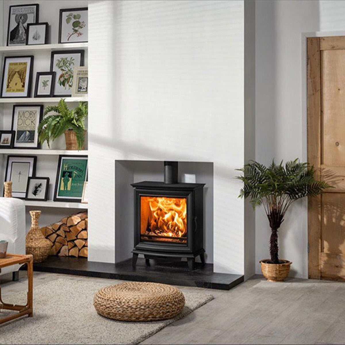 Stovax Chesterfield 5 Wide stove in a white room beside a wooden door