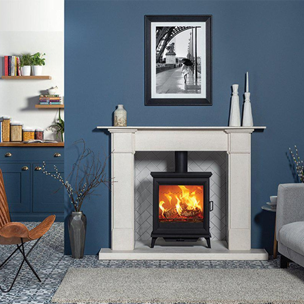 Stovax Sheraton 5 Wide with a pale mantel against a blue wall