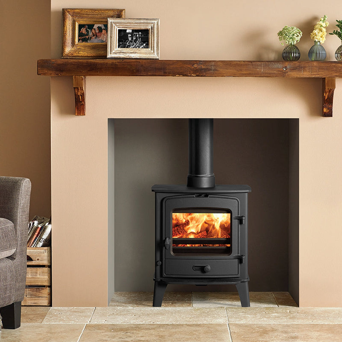 Stovax County 5 stove beneath a timber beam in a warm-toned room