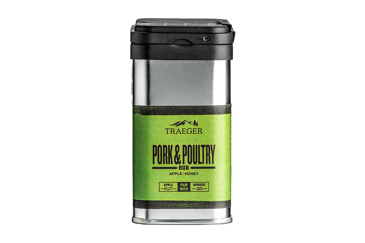 Close-up of a black Traeger "Pork & Poultry Rub" container with green labeling. The design emphasizes its apple and honey ingredients and provides pairing suggestions.