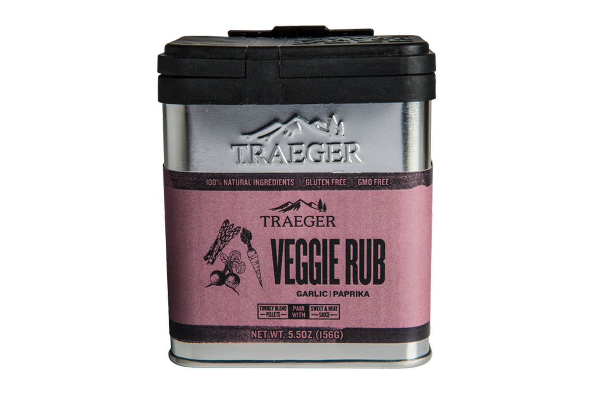 Close-up of a Traeger Veggie Rub aluminium tin featuring its branding, highlighting 100% natural ingredients, gluten-free, and GMO-free labels.