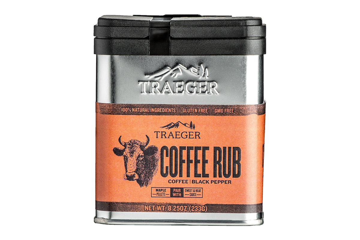 Close-up of the Traeger Coffee Rub aluminium tin showcasing the brand's embossed logo, with highlighted 100% natural ingredients and an artistic illustration of a bull. Experience the robust essence of Traeger Coffee Rub.