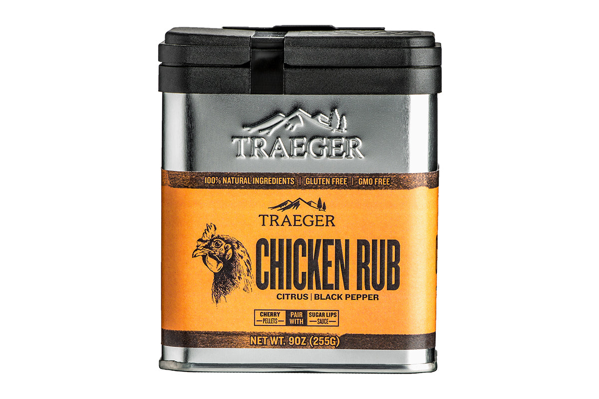 Close-up of the Traeger Chicken Rub aluminium tin with bold branding, highlighting the citrus and black pepper flavours, accompanied by a graphic of a detailed chicken head and the labels "100% Natural Ingredients", "Gluten-Free", and "GMO-Free".