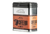 A &quot;Traeger Coffee Rub&quot; container with a Traeger logo. The label highlights &quot;100% Natural Ingredients&quot;, &quot;Gluten Free&quot;, and &quot;GMO Free&quot;. Features a bull&#39;s head design and suggests flavors of &quot;Coffee | Black Pepper&quot;. Suggested pairings include &quot;Maple Pellets&quot; and &quot;Sweet &amp; Heat Sauce&quot;. Net weight is &quot;8.25oz (233g)&quot;. The design combines metallic and orange tones.