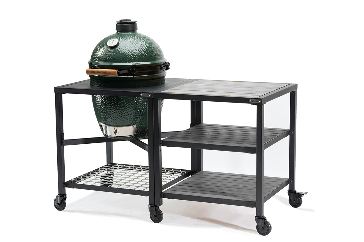 Big Green Egg in a wheeled Modular Nest beside an expansion frame with three grey acacia shelves