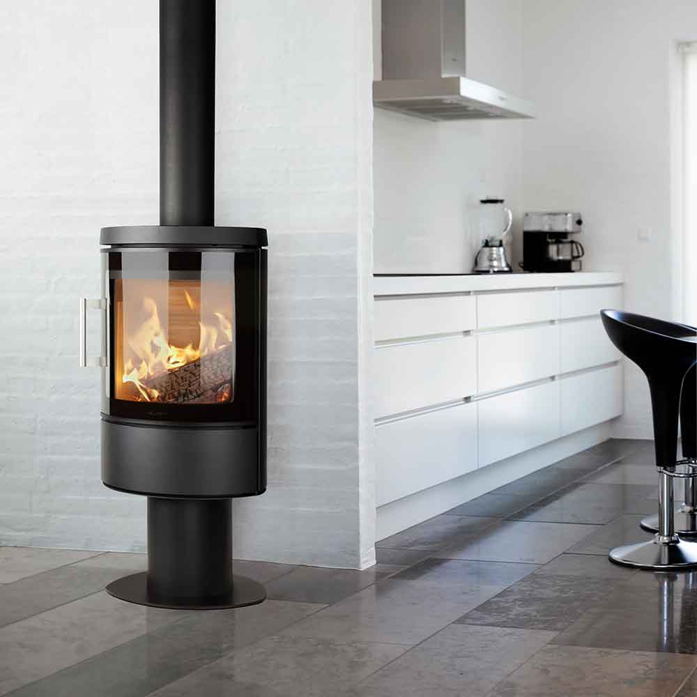 HWAM 3110m wood-burning stove in a room setting