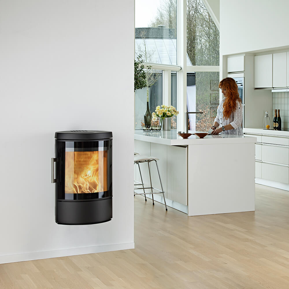 HWAM 3110m wood-burning stove in a room setting