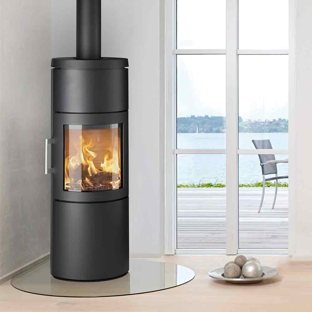 HWAM 3130c wood-burning stove in a room setting