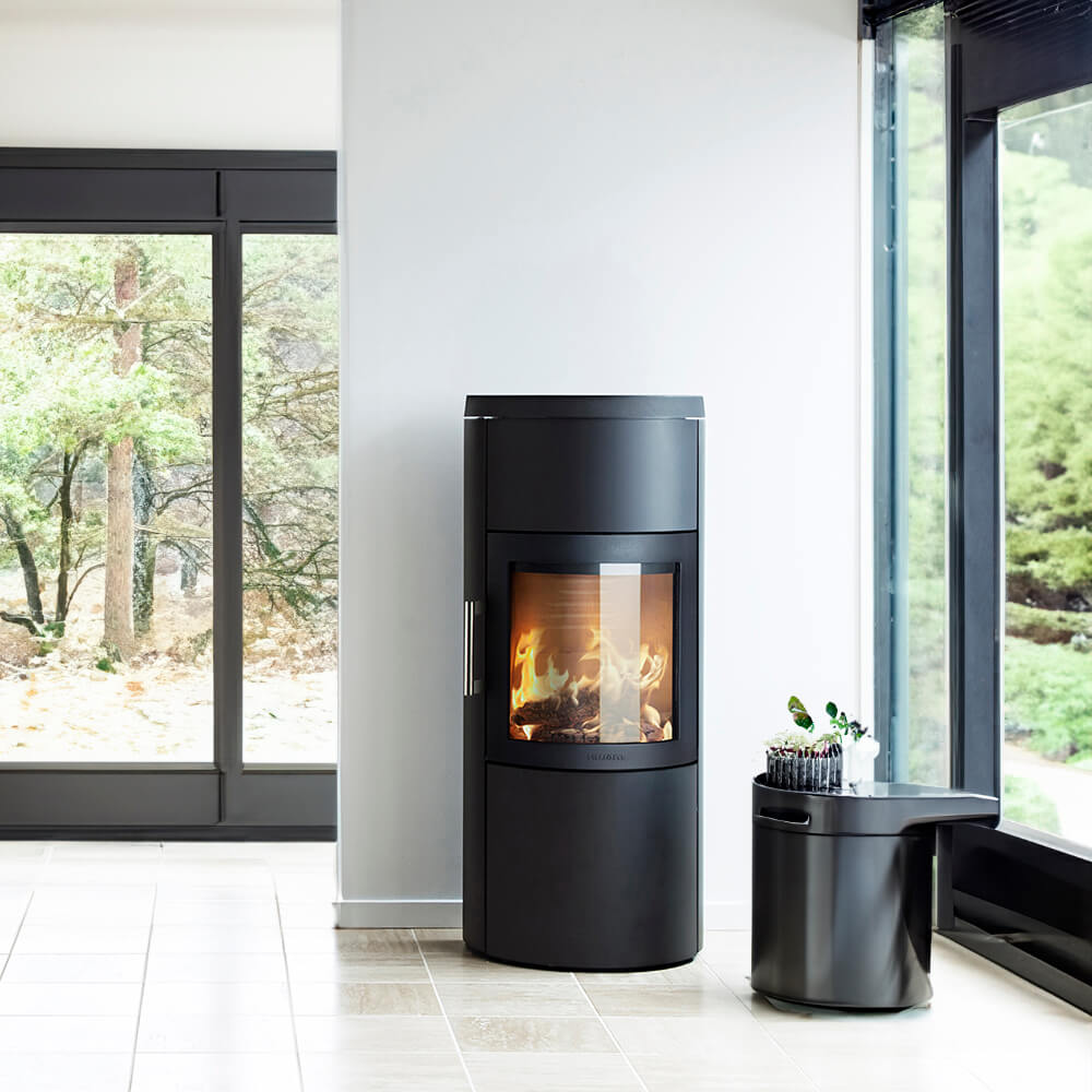 HWAM 3520c wood-burning stove in a room setting