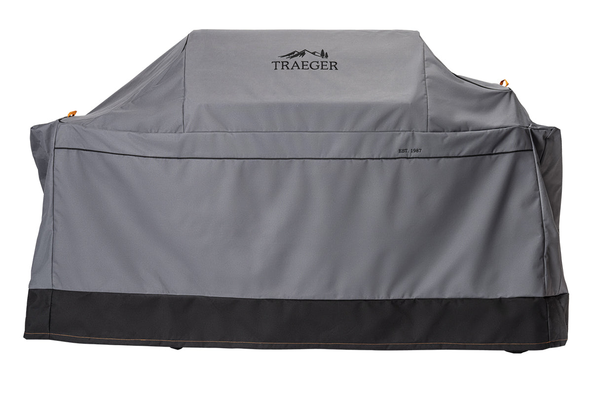 Grey Traeger Ironwood XL full-length grill cover with a black lower edge, front view