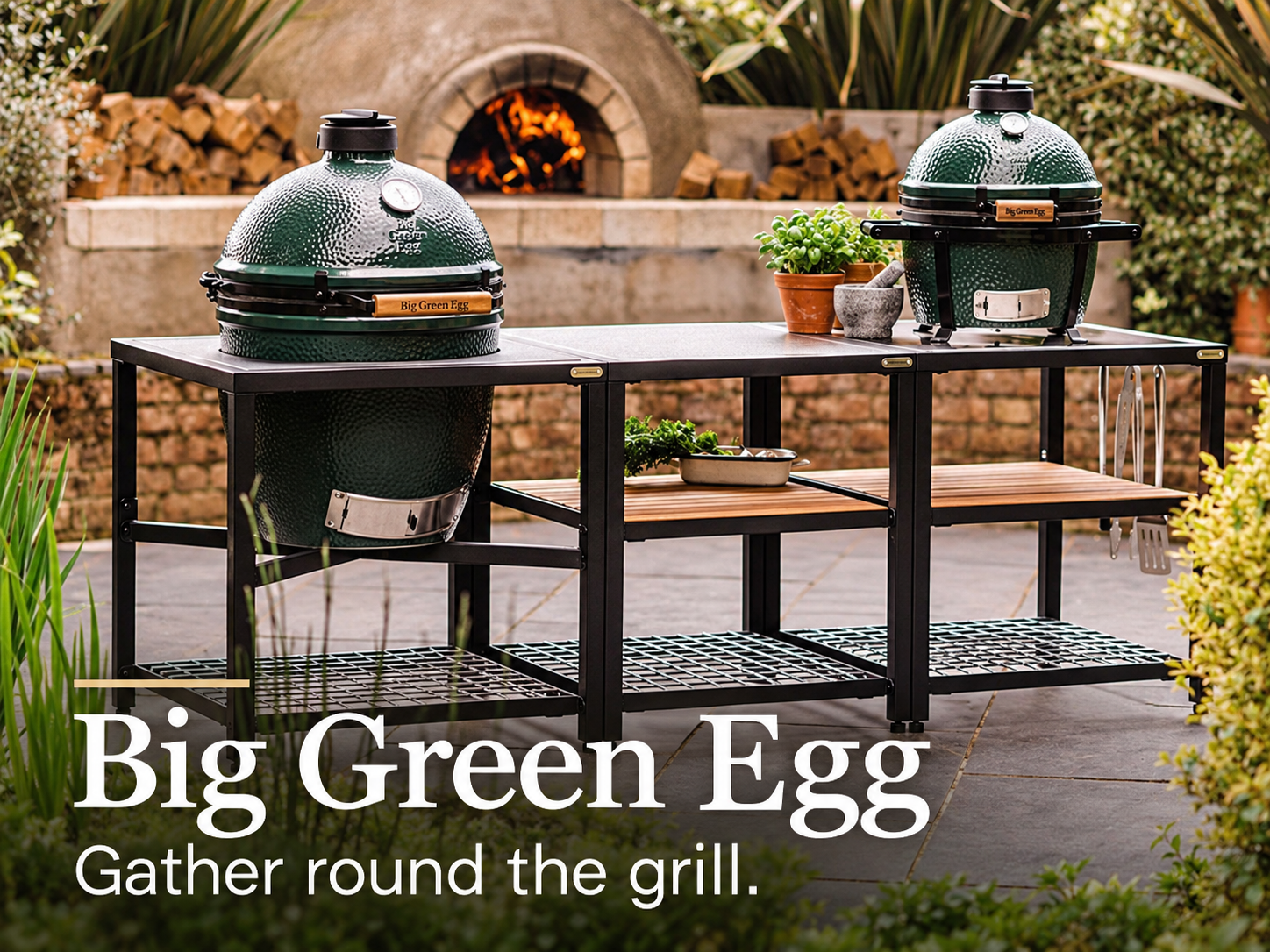 Big Green Egg. Gather round the grill. Two Big Green Egg ceramic cookers in a garden kitchen