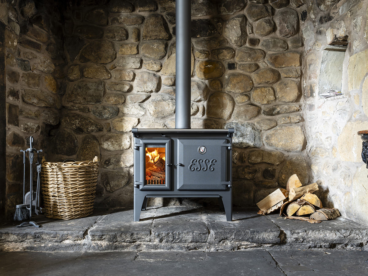 ESSE Lightheart S wood-fired cook stove installed in a furnished room