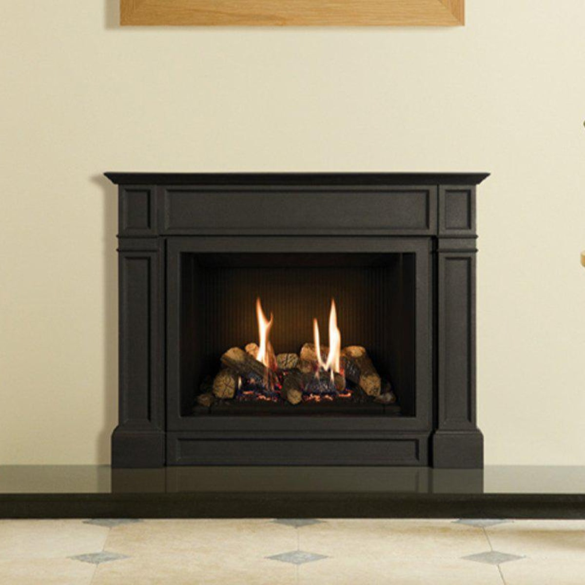 Gazco Riva2 500 Ellingham cast iron gas fire with black reeded lining in a yellow room