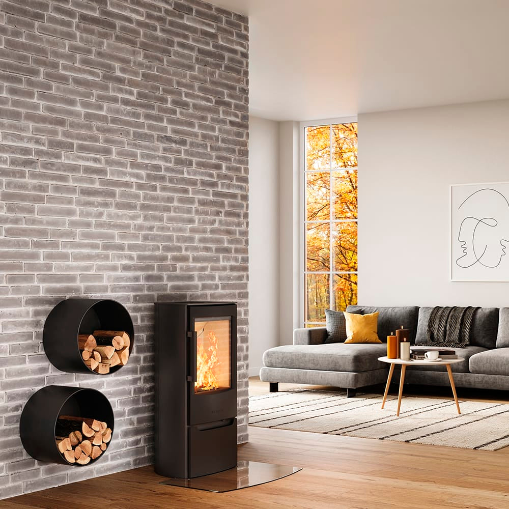 WIKING Miro 4 in black beside round log storage baskets
