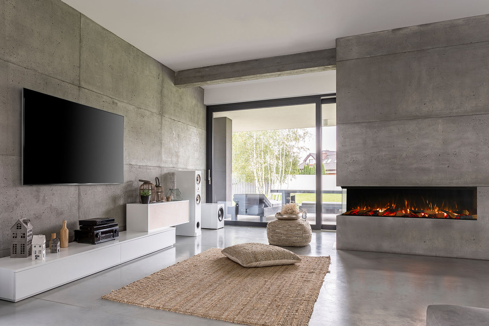 Solus VS180 electric fire with a glass left side in a grey wall beside patio doors