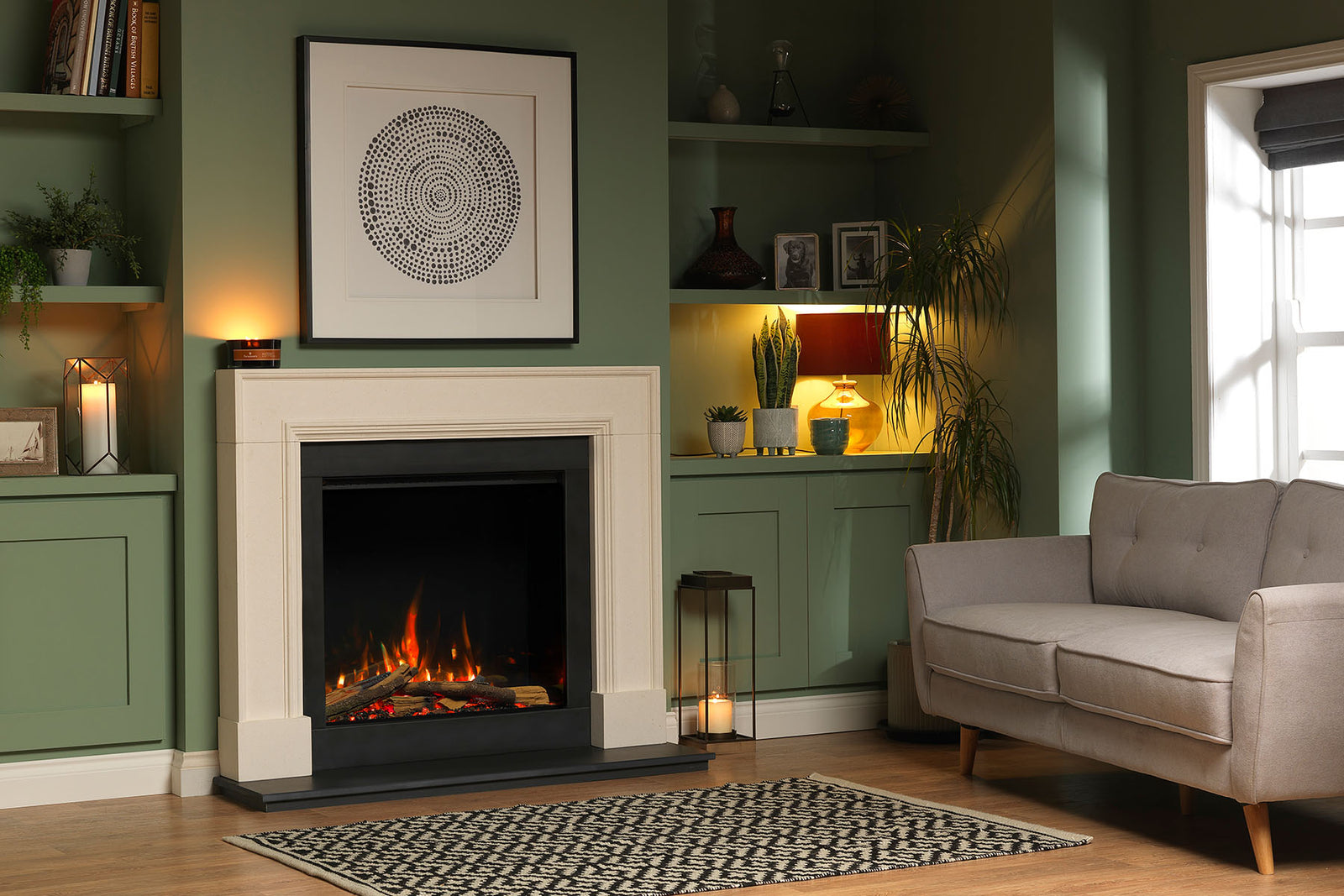 Solus VS75 electric fire in a cream fireplace surround against a green living room wall