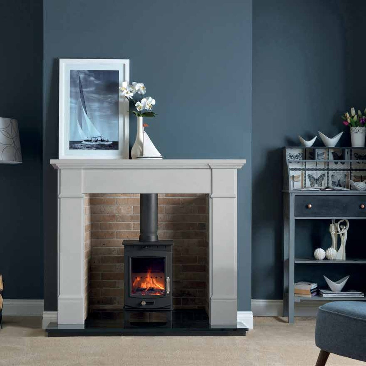Penman Velletri compact Agean limestone fireplace mantel, shown in a room setting