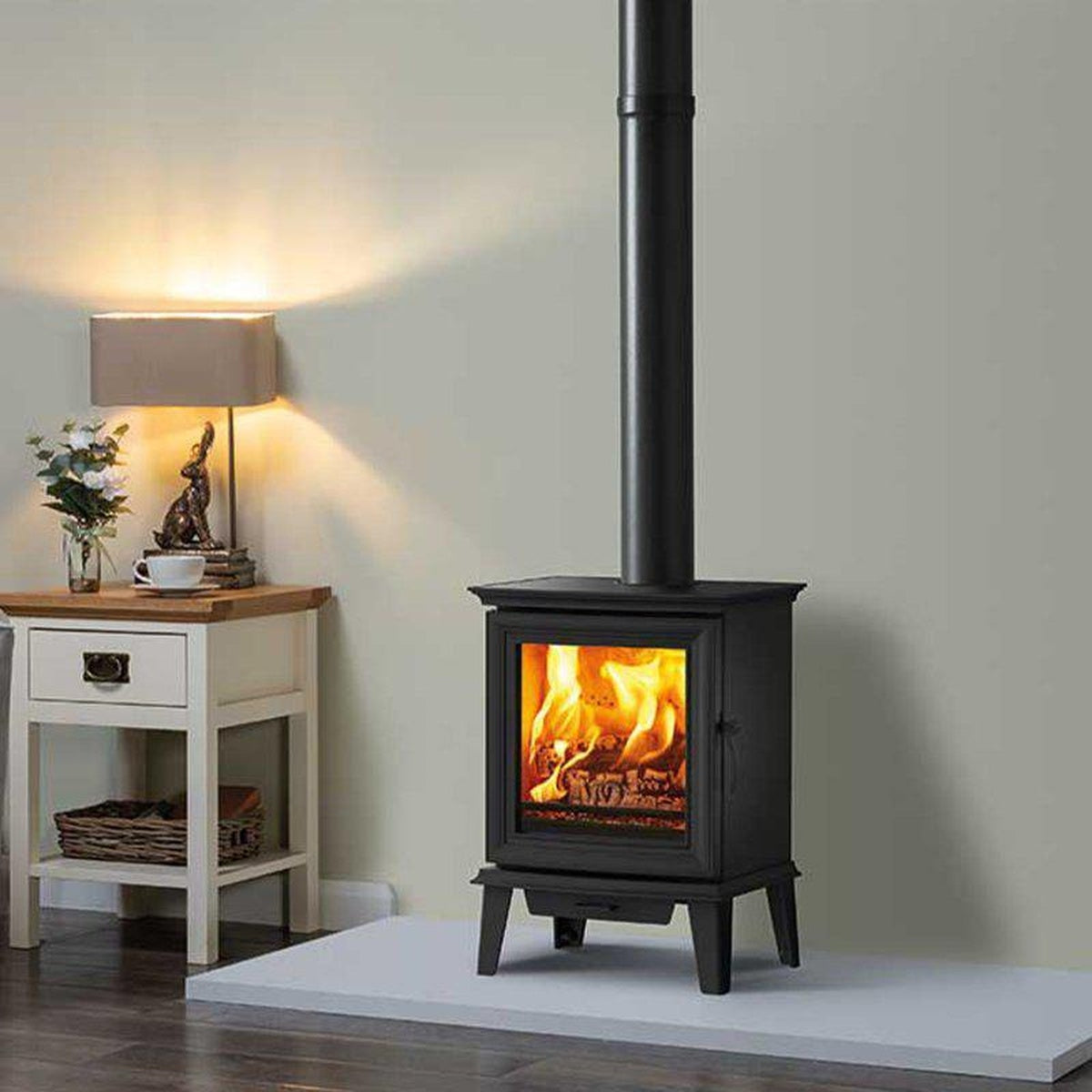 Stovax Chesterfield 5 stove on a hearth beside a grey sofa