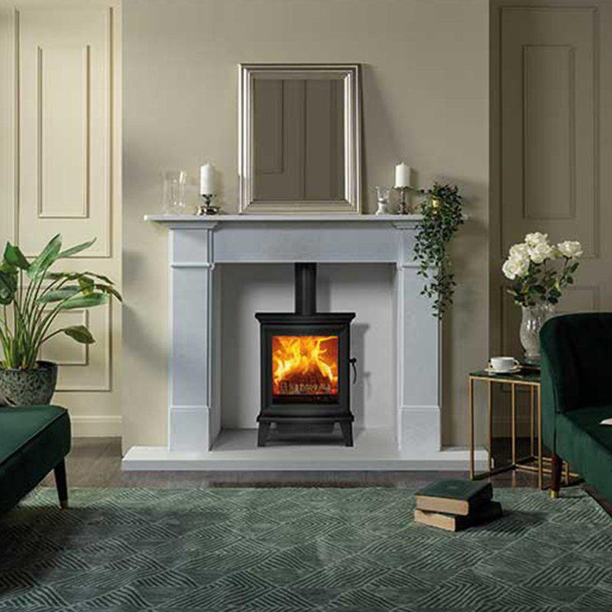 Stovax Chesterfield 5 stove with a pale mantel in a green living room