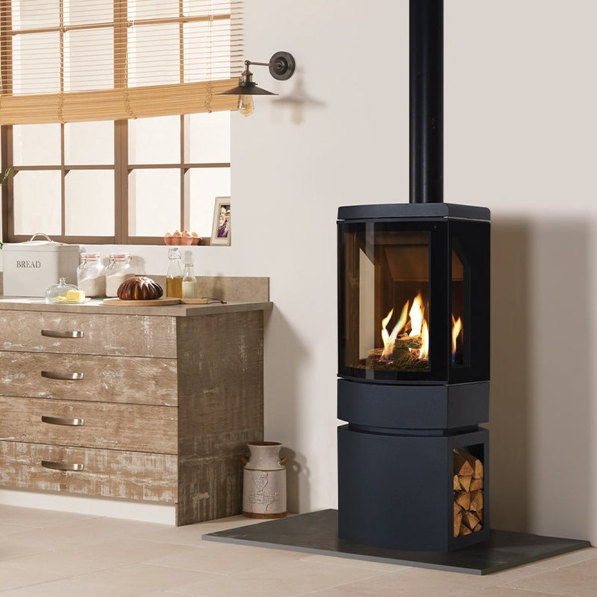 Gazco Loft gas stove with a dark log-store base in a kitchen