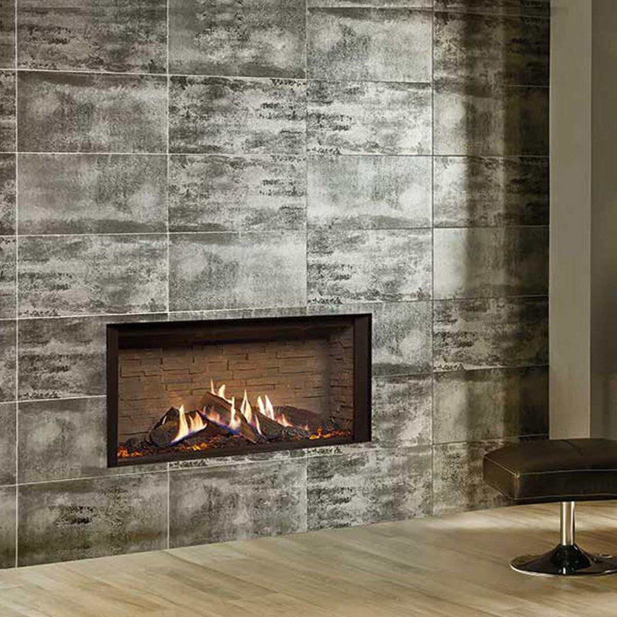 Gazco Reflex 105 Edge gas fire with ledgestone-effect lining in a pale tiled wall