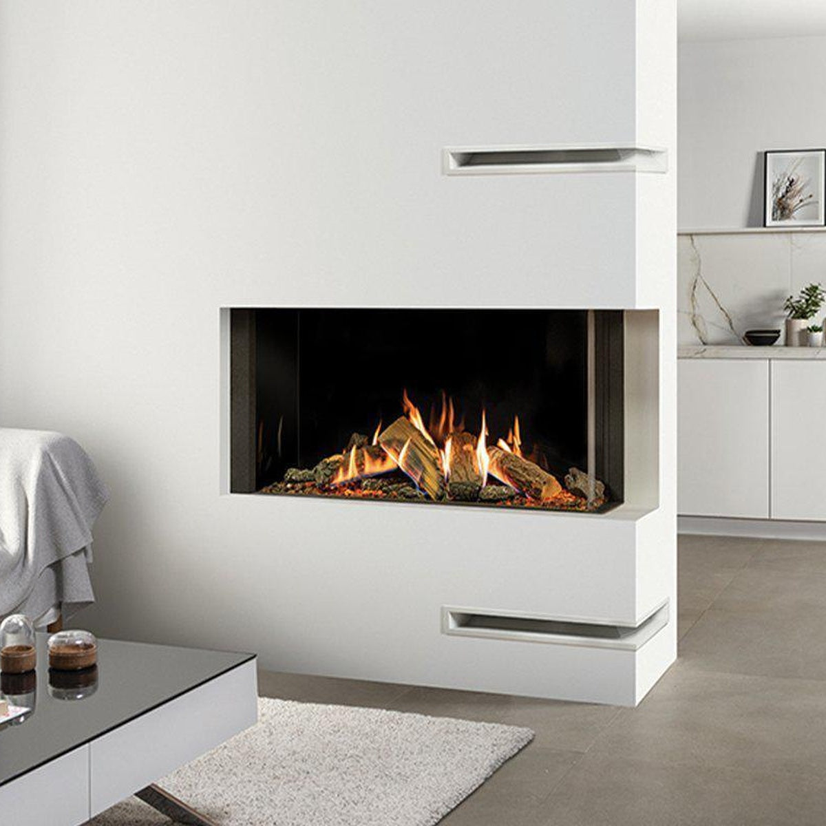 Gazco Reflex 105 Multi-sided gas fire in a white room divider beside a grey sofa