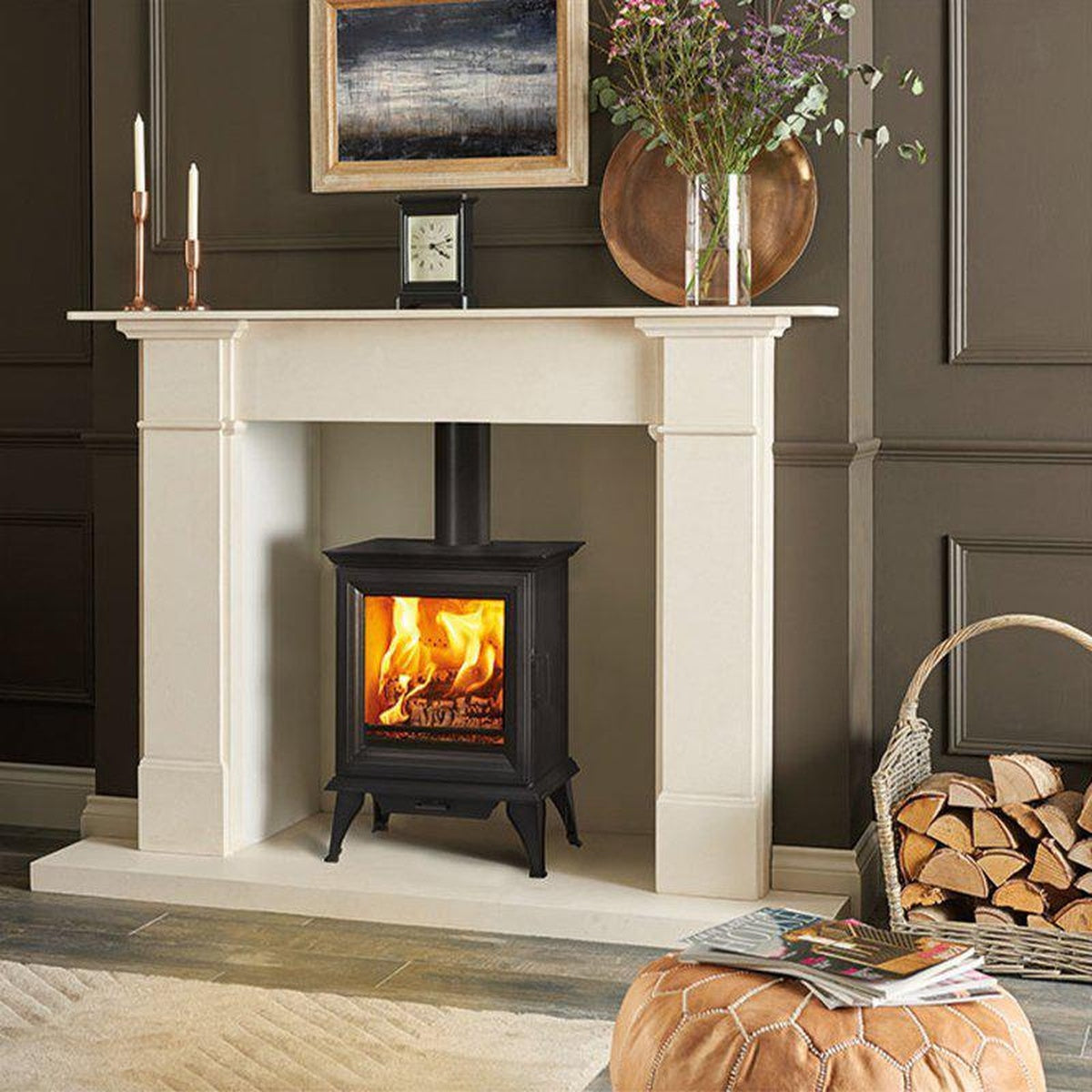 Stovax Sheraton 5 with a pale stone mantel in a dark living room