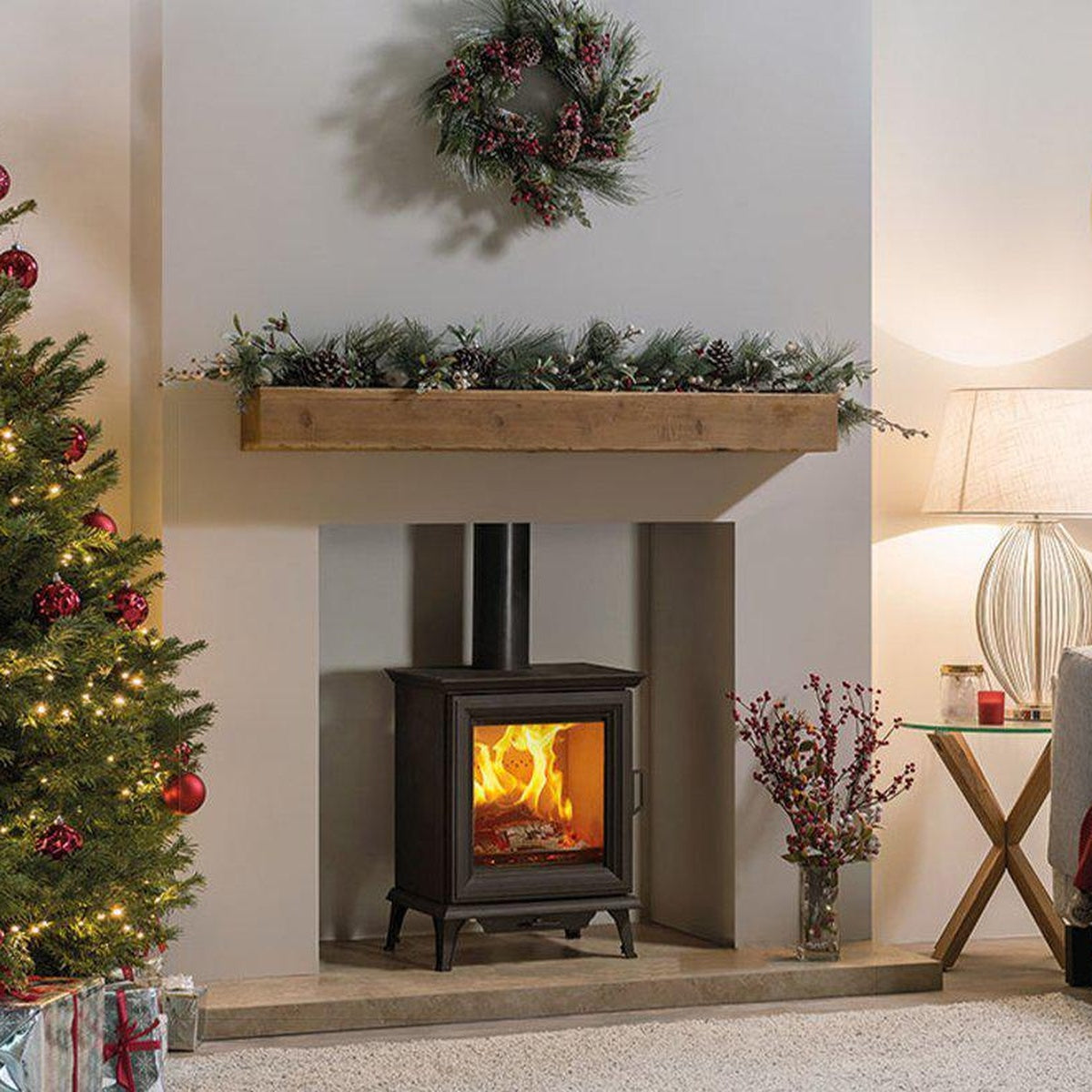 Stovax Sheraton 5 in a festive room with a timber beam