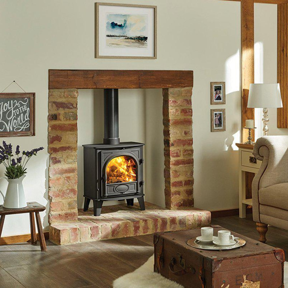 Stovax Stockton 5 Matt Black woodburning stove in a brick fireplace