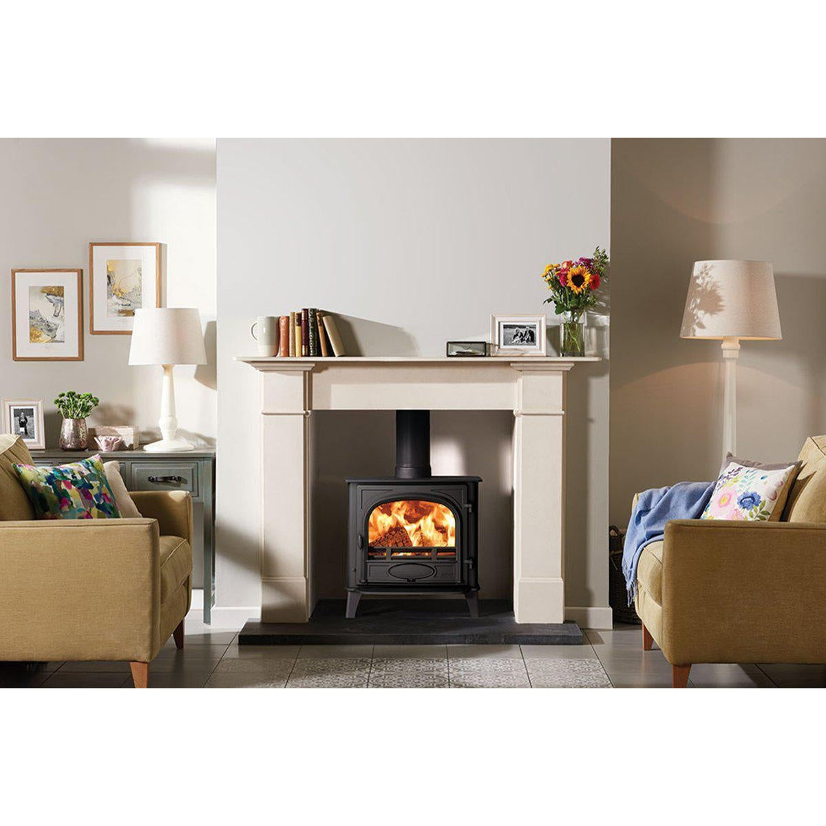 Stovax Stockton 5 Wide Matt Black single-door fixed-grate multi-fuel stove with limestone mantel