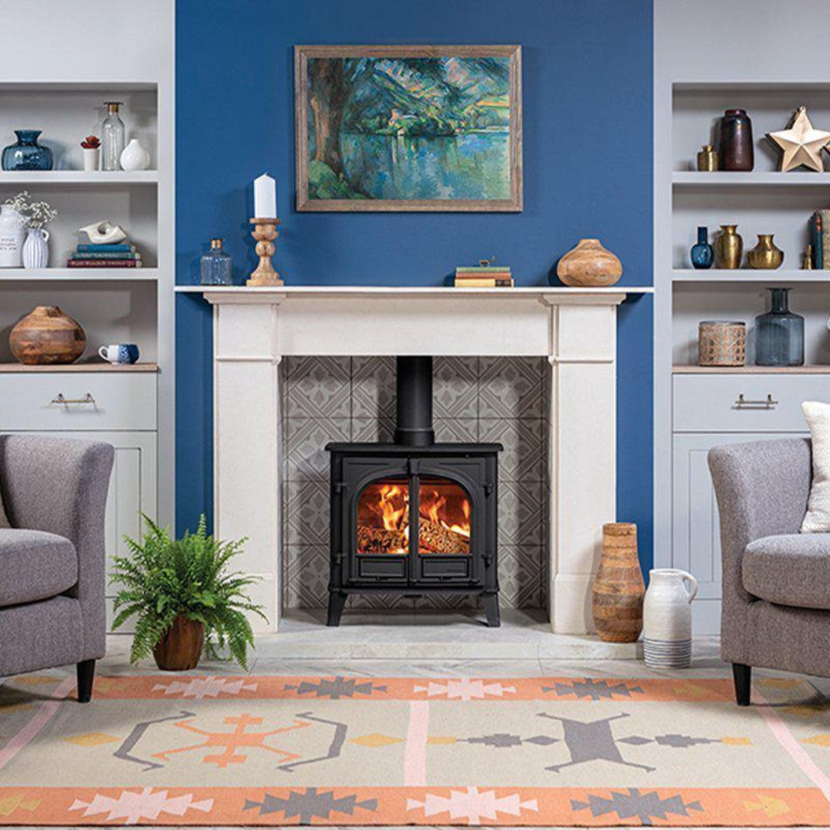 Stovax Stockton 8 Matt Black double-door woodburning stove in a blue room