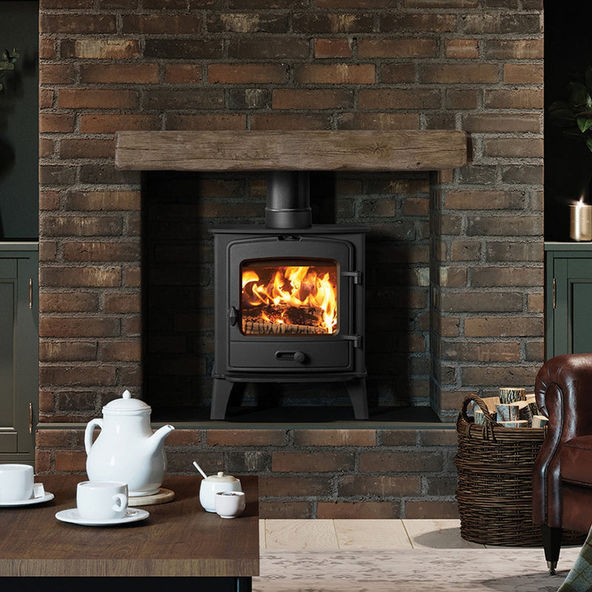 Stovax County 5 stove in a brick fireplace in a living room