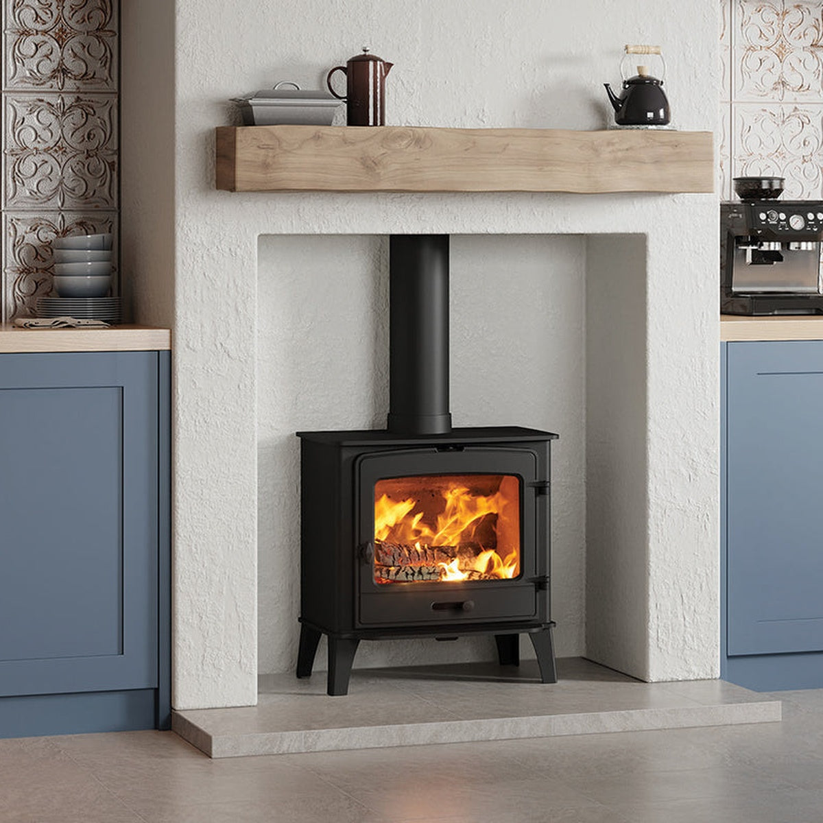 Stovax County 8 stove beneath a pale beam in a kitchen