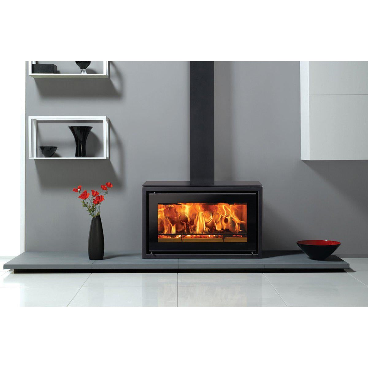 Stovax Studio 1 Freestanding wood burning stove on a white shelf — The Stove Yard