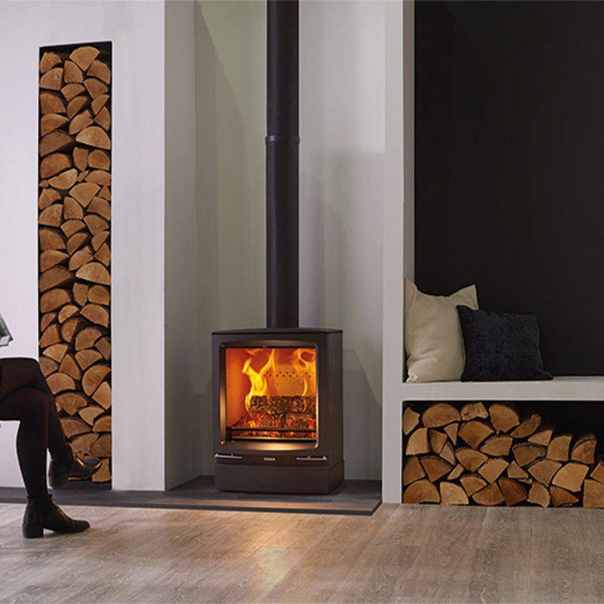 Stovax Vogue Midi stove with plinth beside built-in log storage