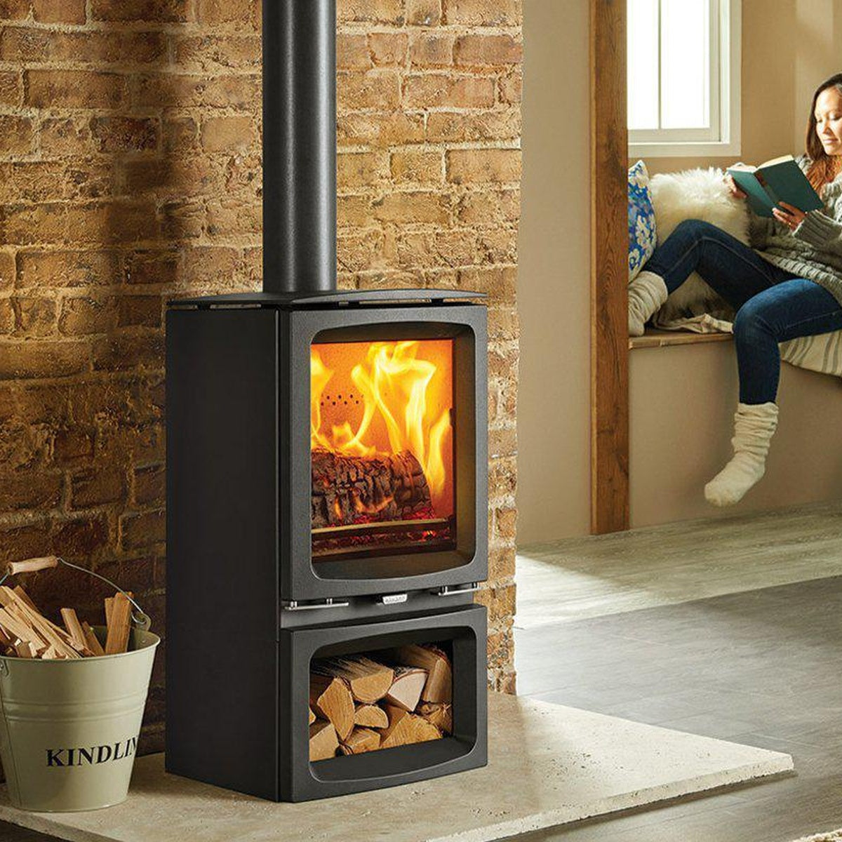 Stovax Vogue Midi stove with Midline log-store base beside a window seat