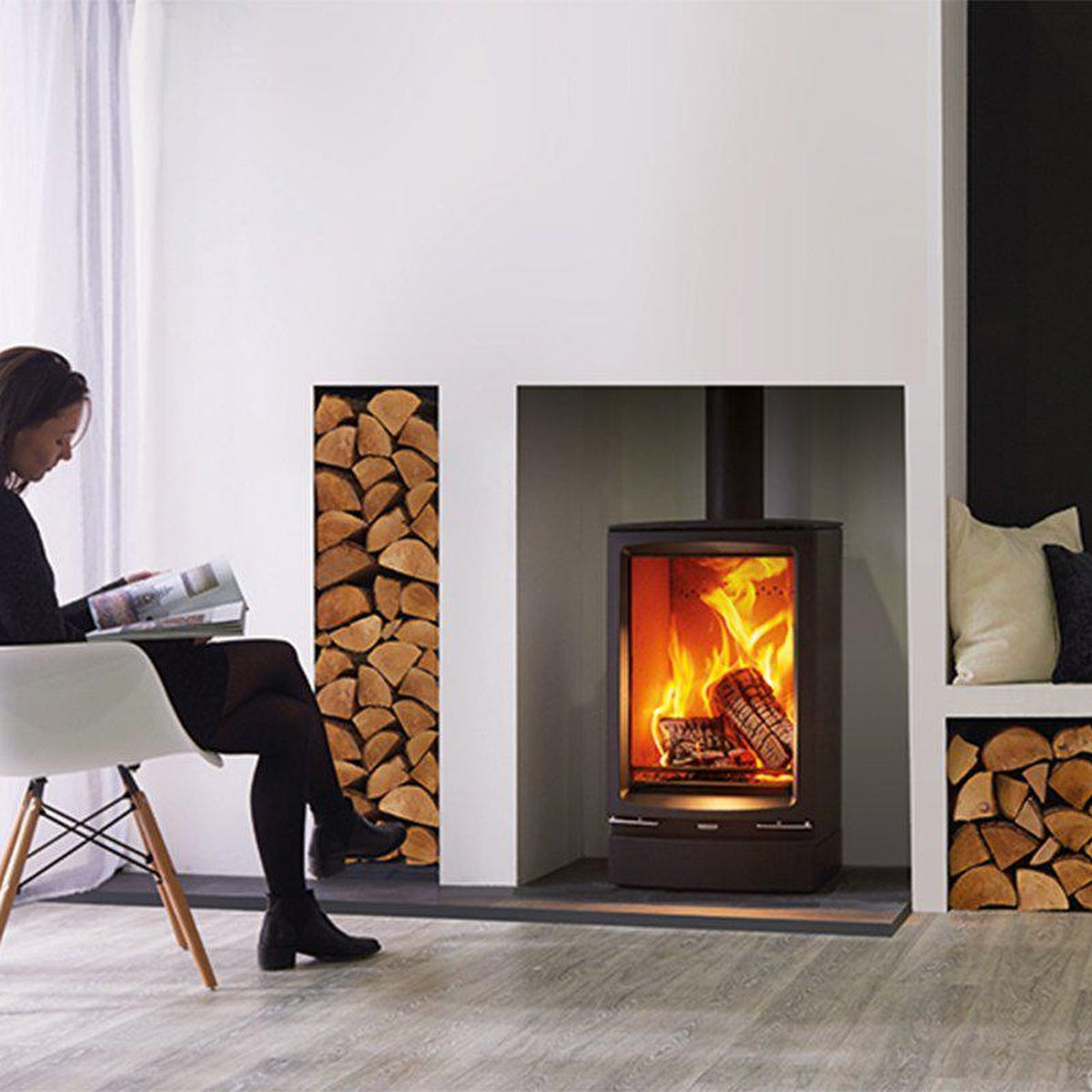 Stovax Vogue Midi T stove with plinth beside built-in log storage