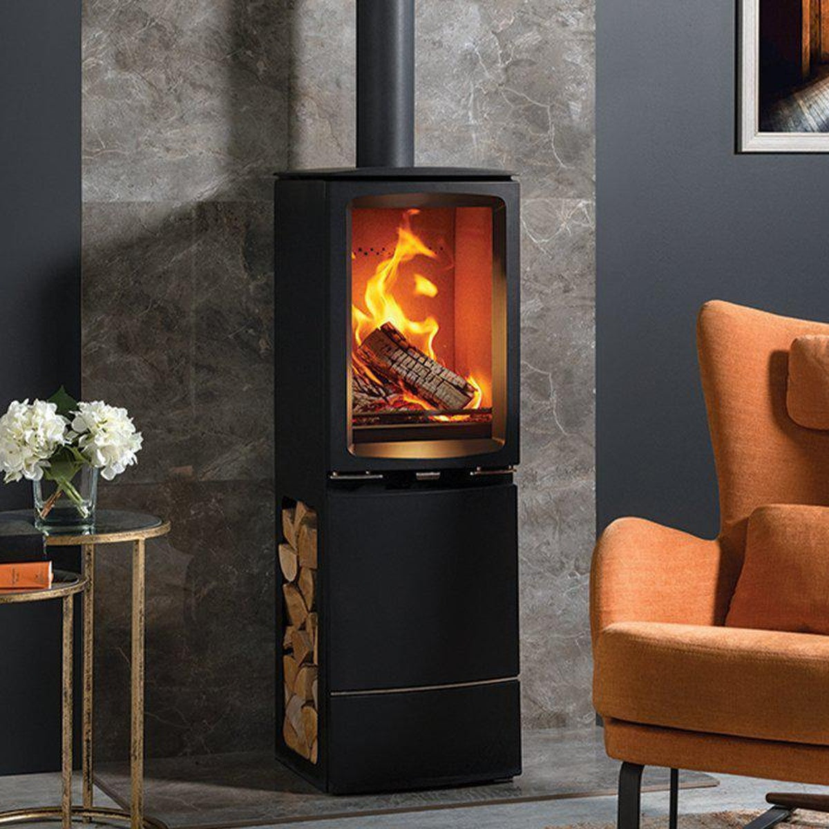 Stovax Vogue Midi T Highline stove beside an orange armchair