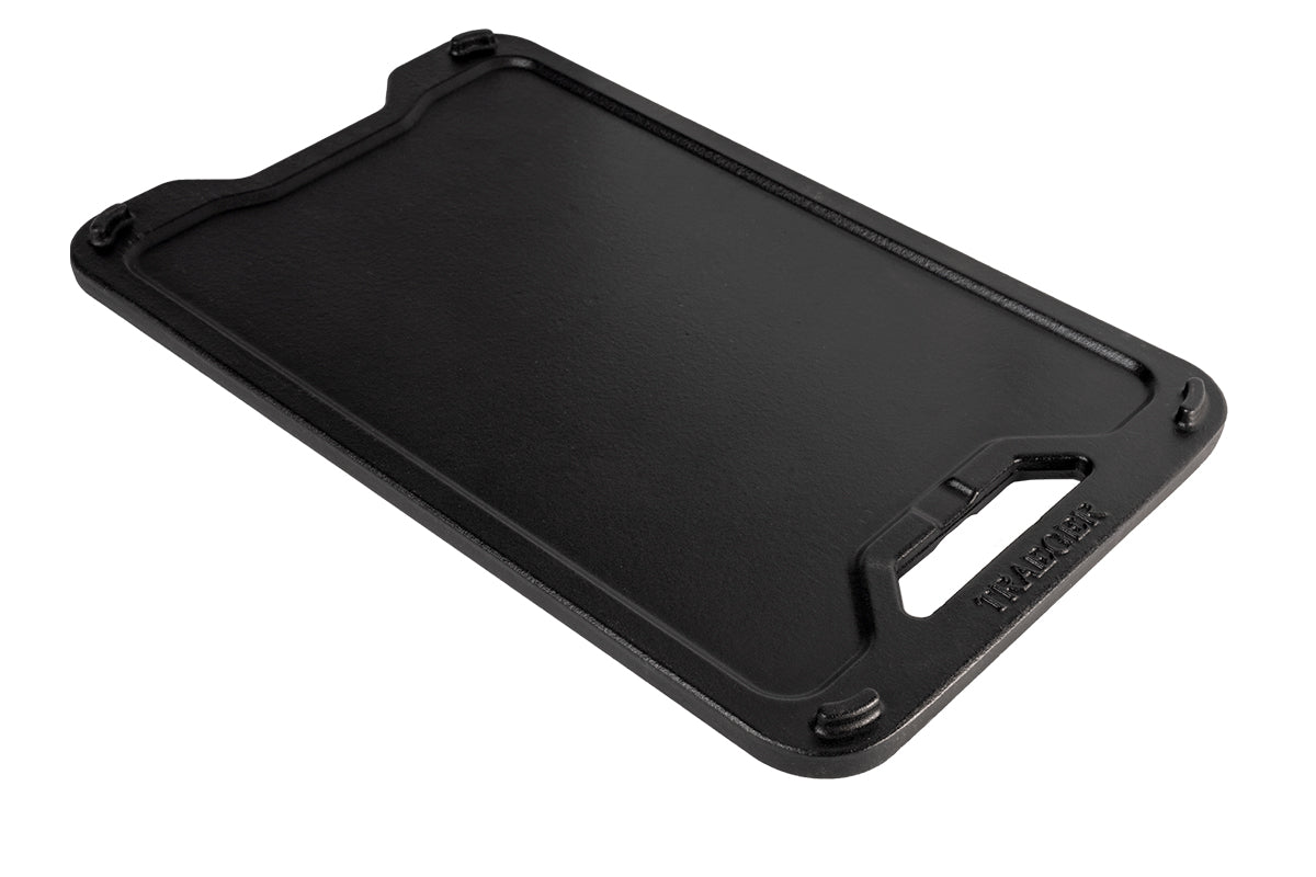 Flat side of the Traeger ModiFIRE reversible cast iron griddle viewed at an angle