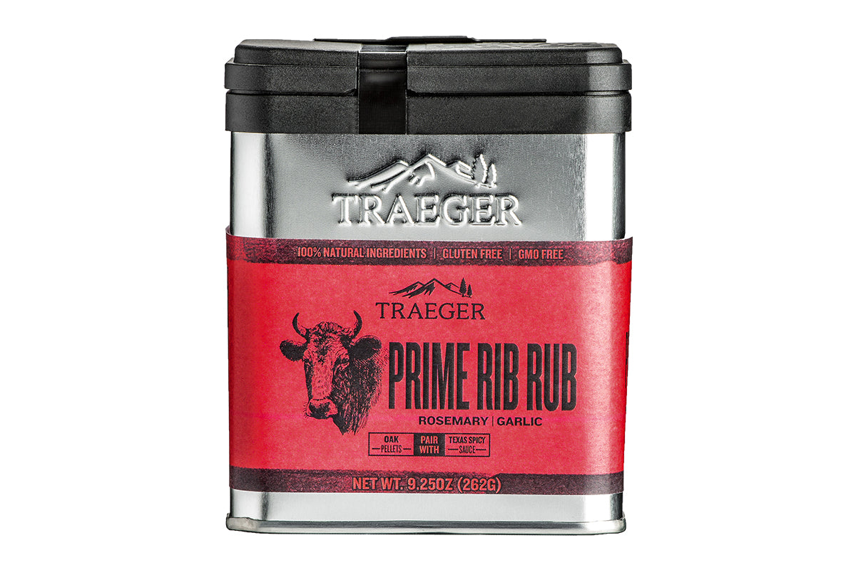A robust aluminium tin of Traeger Prime Rib Rub, adorned with a vibrant red label showcasing a bull illustration, the Traeger logo, and clear mentions of its 100% natural ingredients, gluten-free and GMO-free properties.
