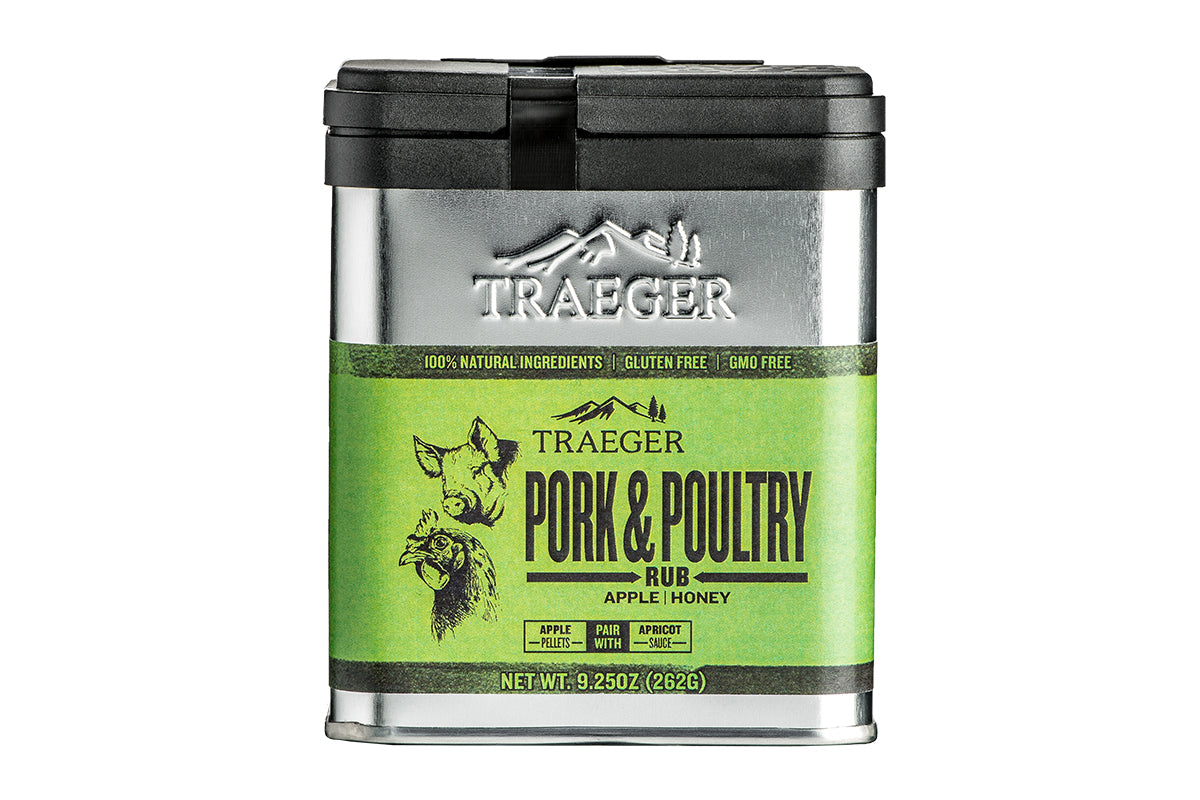 A container of "Traeger Pork & Poultry Rub" seasoning. It emphasizes its 100% natural ingredients, being gluten-free, and GMO-free. The label suggests pairing with apricot sauce. The illustration on the container depicts a pig and a chicken.