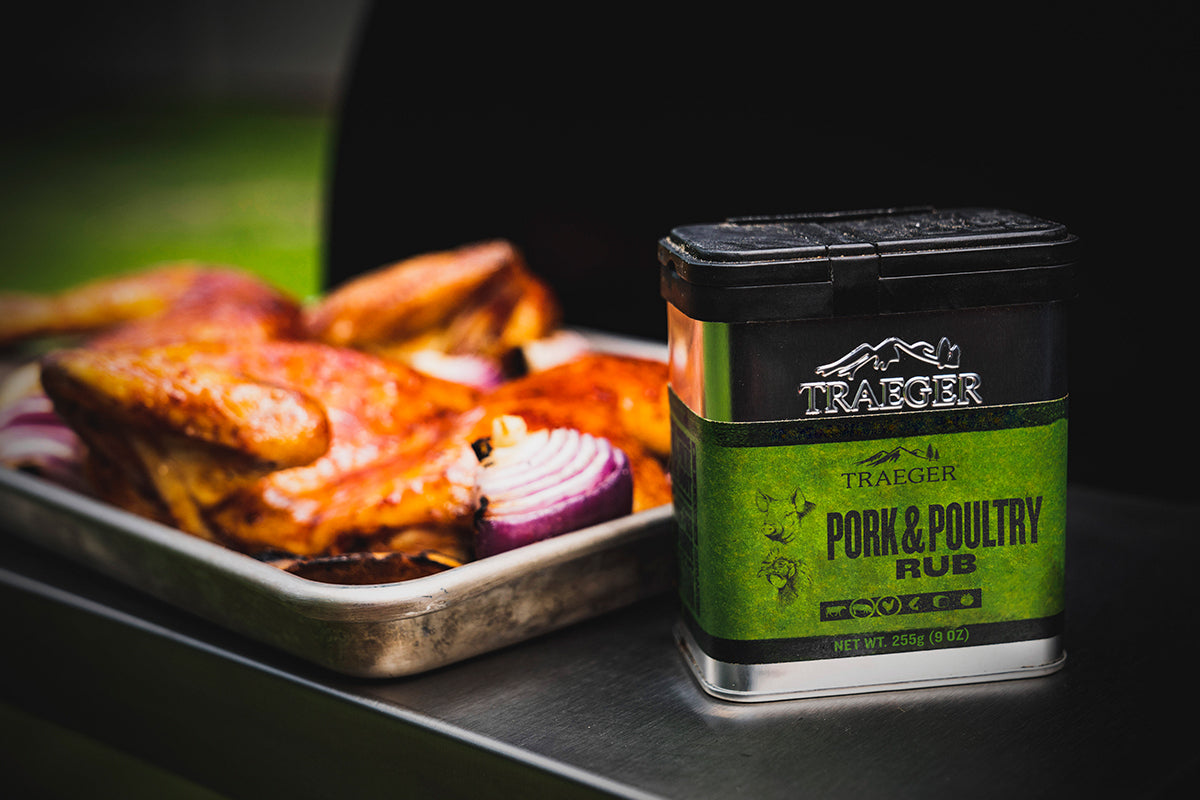 A closer view of the Traeger "Pork &amp; Poultry Rub" container, showcasing the green labeling and details such as "100% natural ingredients," "gluten-free," and "GMO-free."
