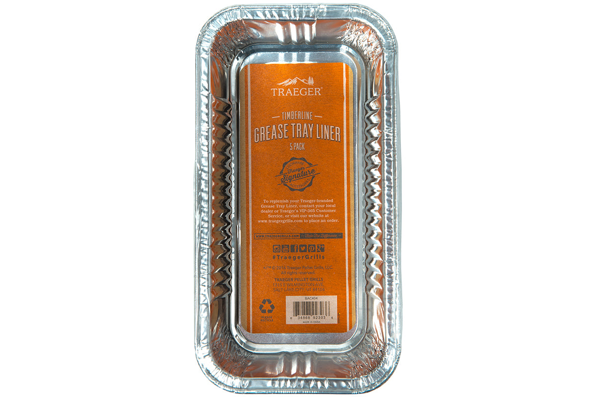 Top view of the Traeger Timberline grease tray liner five-pack with orange product label