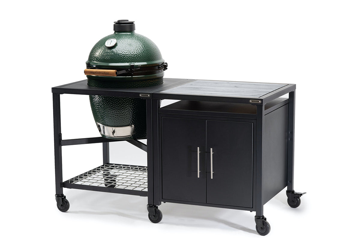 Big Green Egg in a wheeled Modular Nest beside a two-door expansion cabinet with a grey acacia worktop