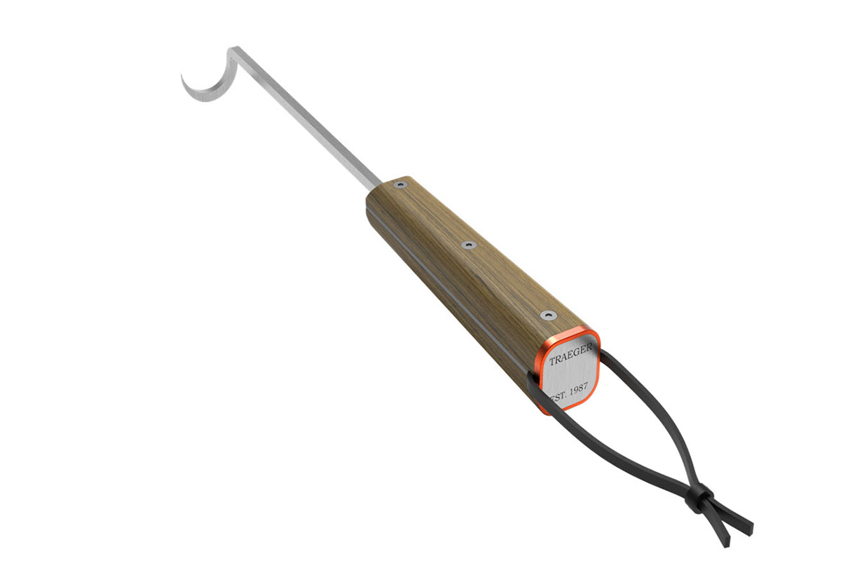 Close-up of the Traeger BBQ Pig Tail wooden handle, branded end cap and hanging loop