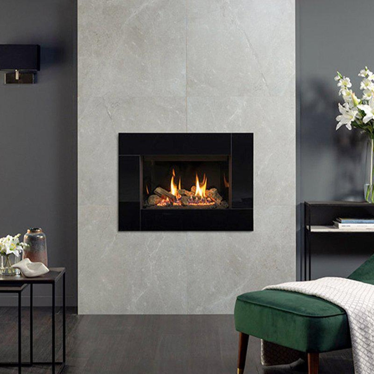 Gazco Riva2 600 Icon XS gas fire with black glass lining in a grey living-room wall